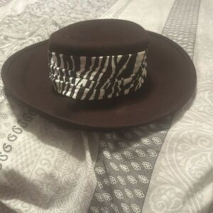 Ladies Slightly worn brown and white hat.